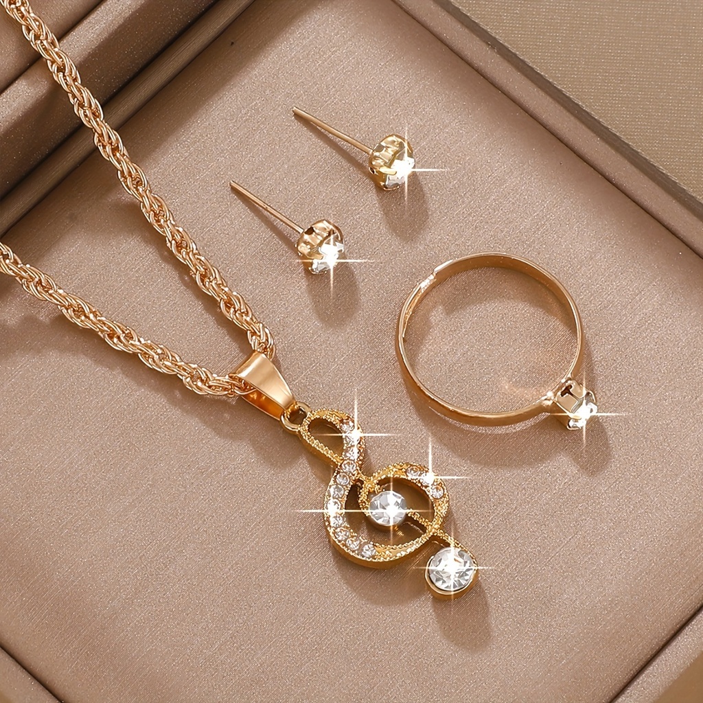 Set de 4 Piezas de Joyería: Collar, Aretes y Anillo con Detalle de Nota Musical